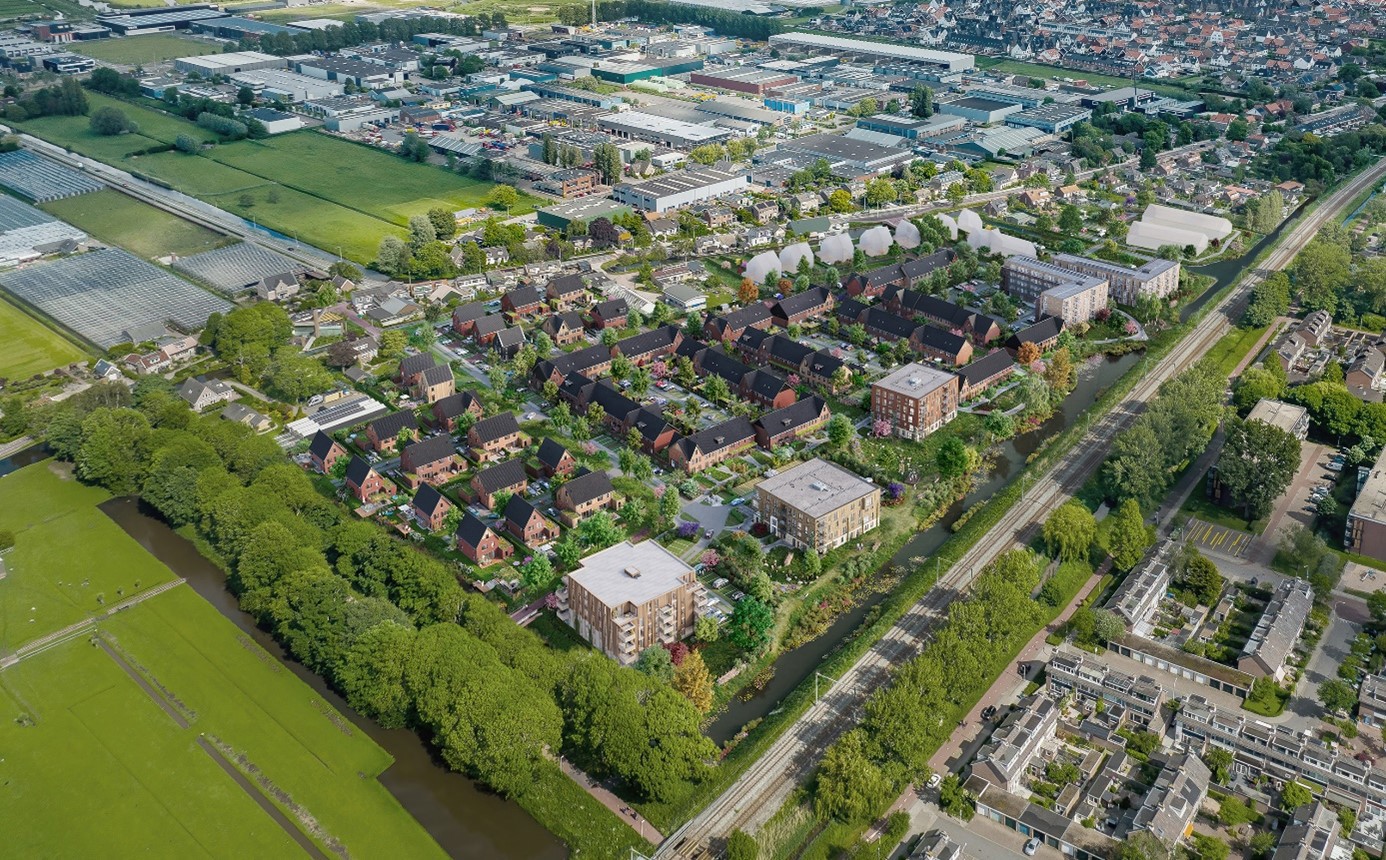 Aerial view of a new residential neighborhood featuring green gardens, water features, and surrounding infrastructure.