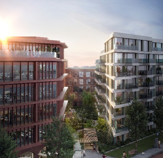 Moderne appartementencomplexen met zonnepanelen en groene gebieden, gefotografeerd tijdens de zonsondergang.