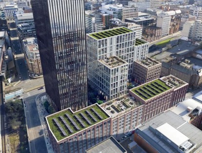 Modern city buildings with green roofs and terraces, situated in an urban environment.