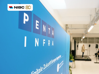 Blue wall with the text PENTA INFRA and the NIBC logo, with a speaker on a podium in the background.