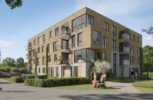 Modern apartment complex with a nature-inspired facade, a green garden, and people walking outside with a stroller.