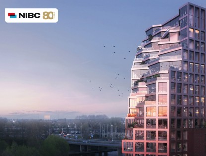 Modern, high-rise residential tower with glass balconies and a soft pink hue, situated next to a highway under a clear sky.