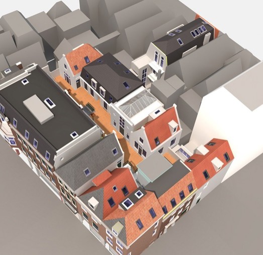 3D-model van een stedelijk gebied met huizen, daken in diverse kleuren en een centraal pad tussen de gebouwen.